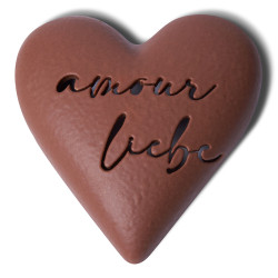 Heart engraved with love in milk chocolate